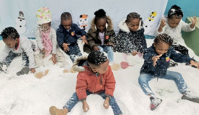 Young pupils enjoying a snow-themed party